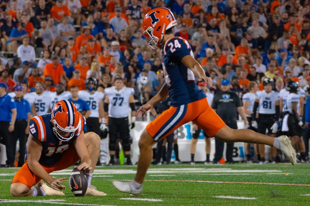 Junior kicker David Olano winds up for a massive kick during the first football game of the 2024 season in Gies Memorial Stadium.