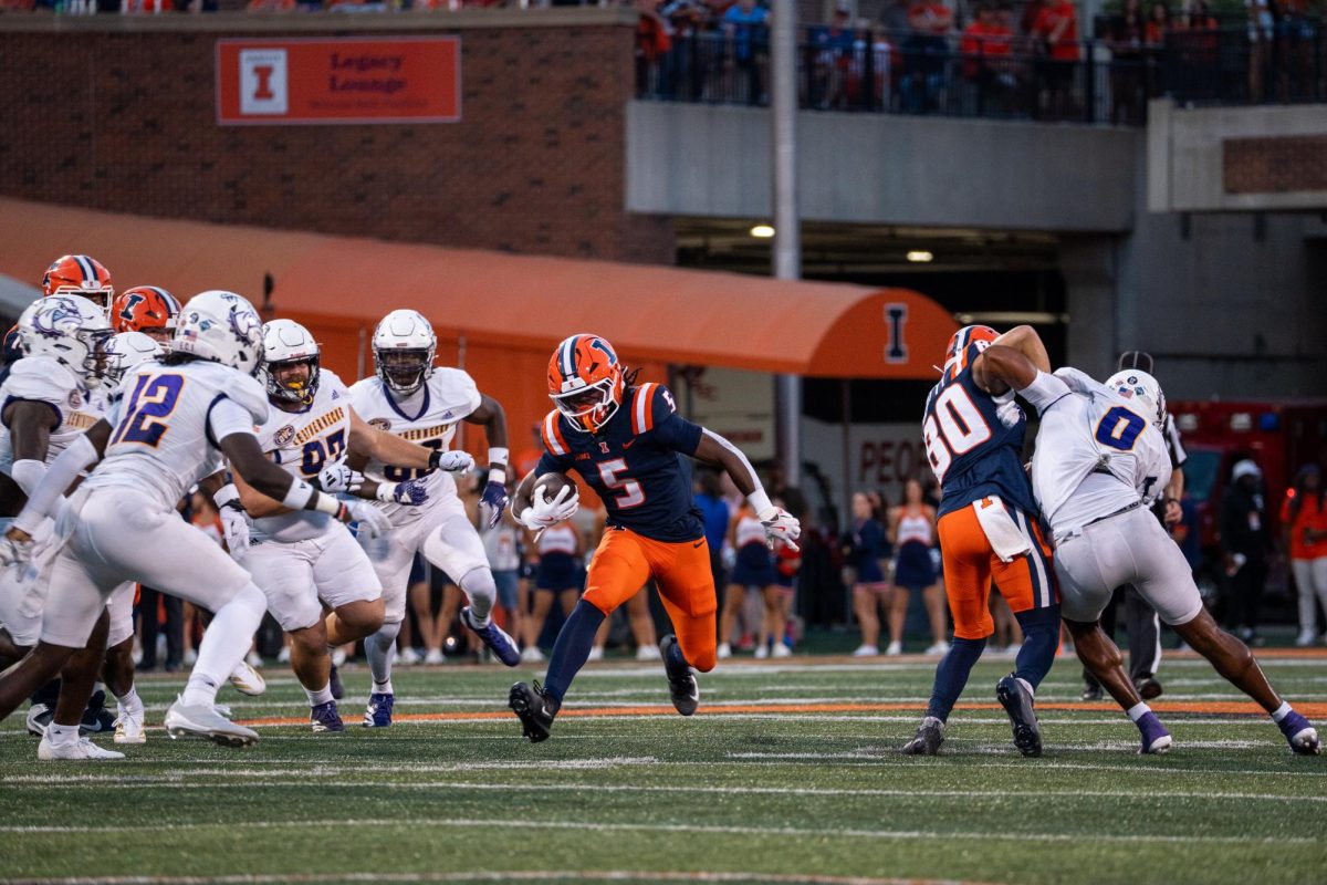 Sophomore running back Ca’Lil Valentine jukes out defenders during Illinois’ game against Western Illinois on Aug. 29.
