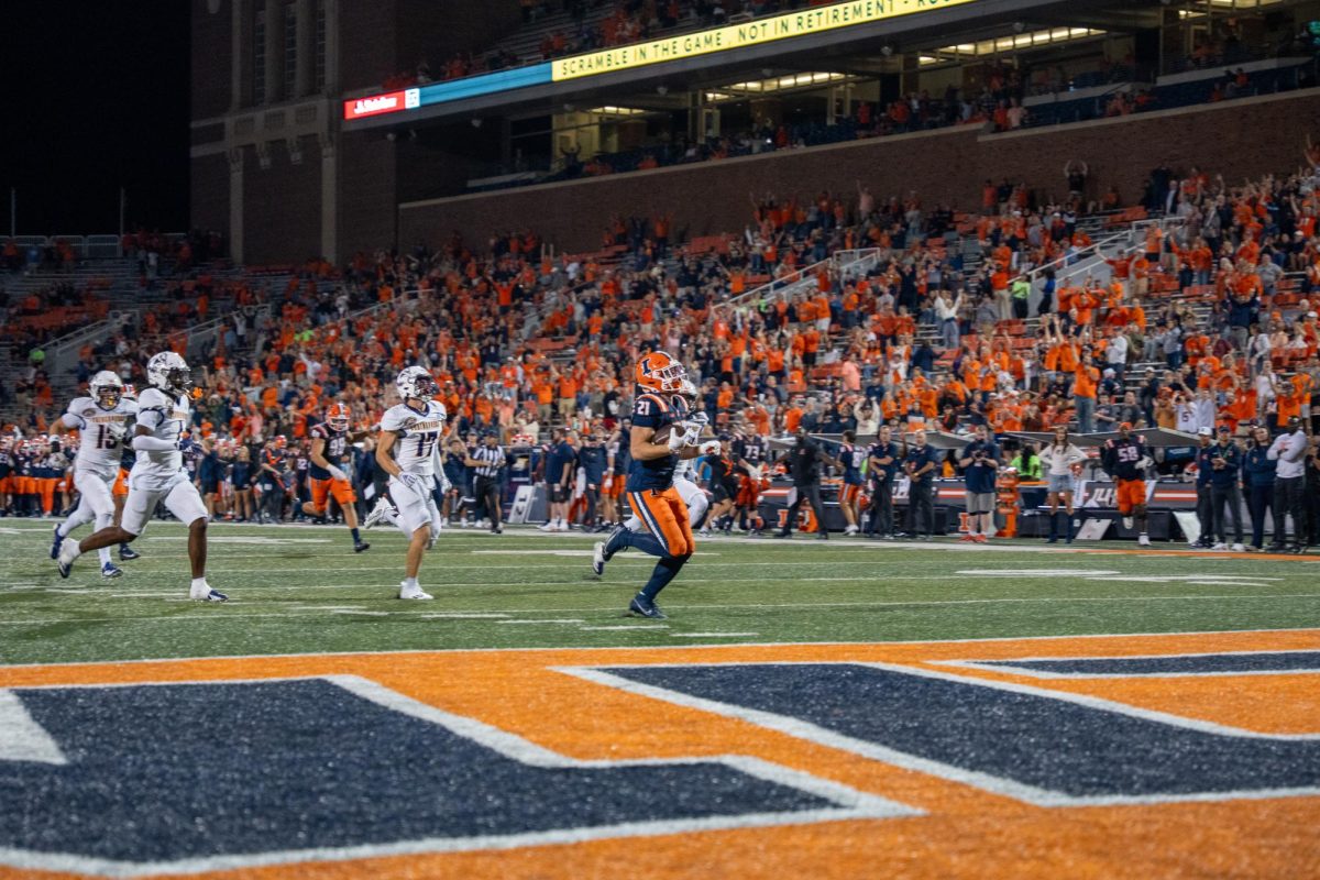 Junior running back Aidan Laughery rushes for a touchdown during Illinois’ game against Western Illinois on Aug. 29. 
