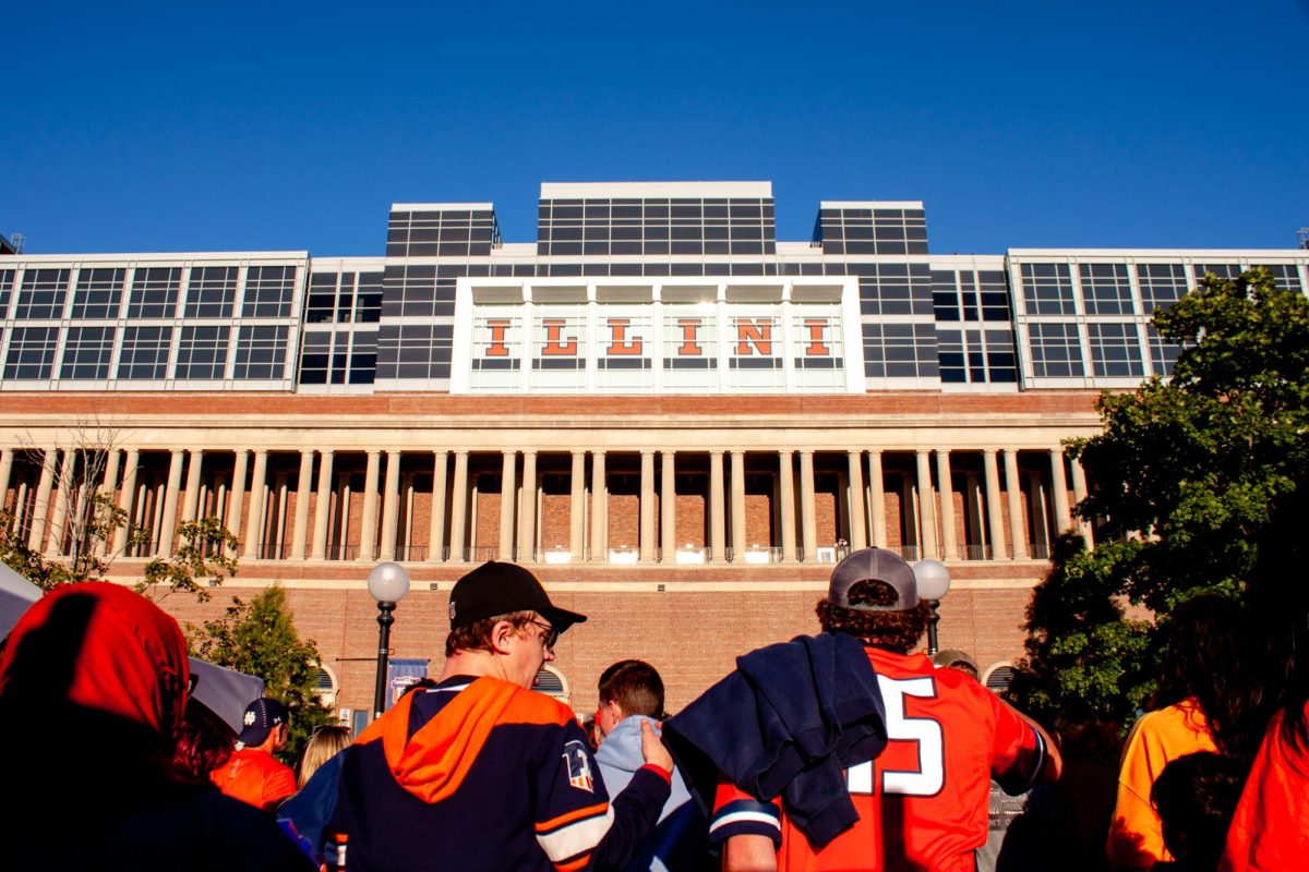 A crowd of Illini fans making their way into Gies Memorial Stadium, previously called Memorial Stadium, on Sept. 7, 2024. The University of Illinois Board of Trustees unanimously approved the renaming on Thursday.   