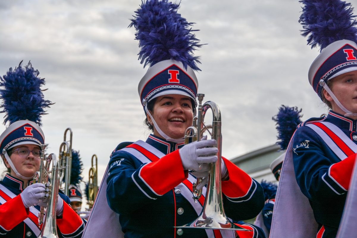 A mellophone player in the Marching Illini walks in the 2024 Homecoming Parade on Sept. 13, 2024.