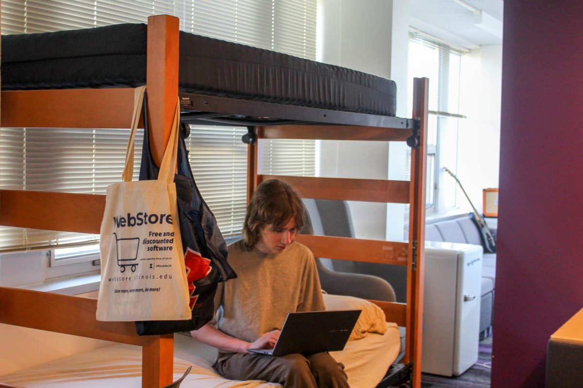 Kai Henning, a freshman in Engineering, sits in a Wardall Hall lounge that his been converted into a room on Sept. 16. The temporary arrangement houses three students while the University waits for space in a permanent room.