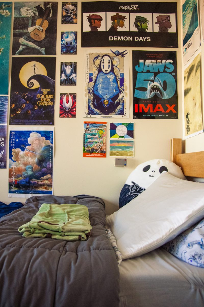Van Krey's bed is made, and posters fill the space around it.