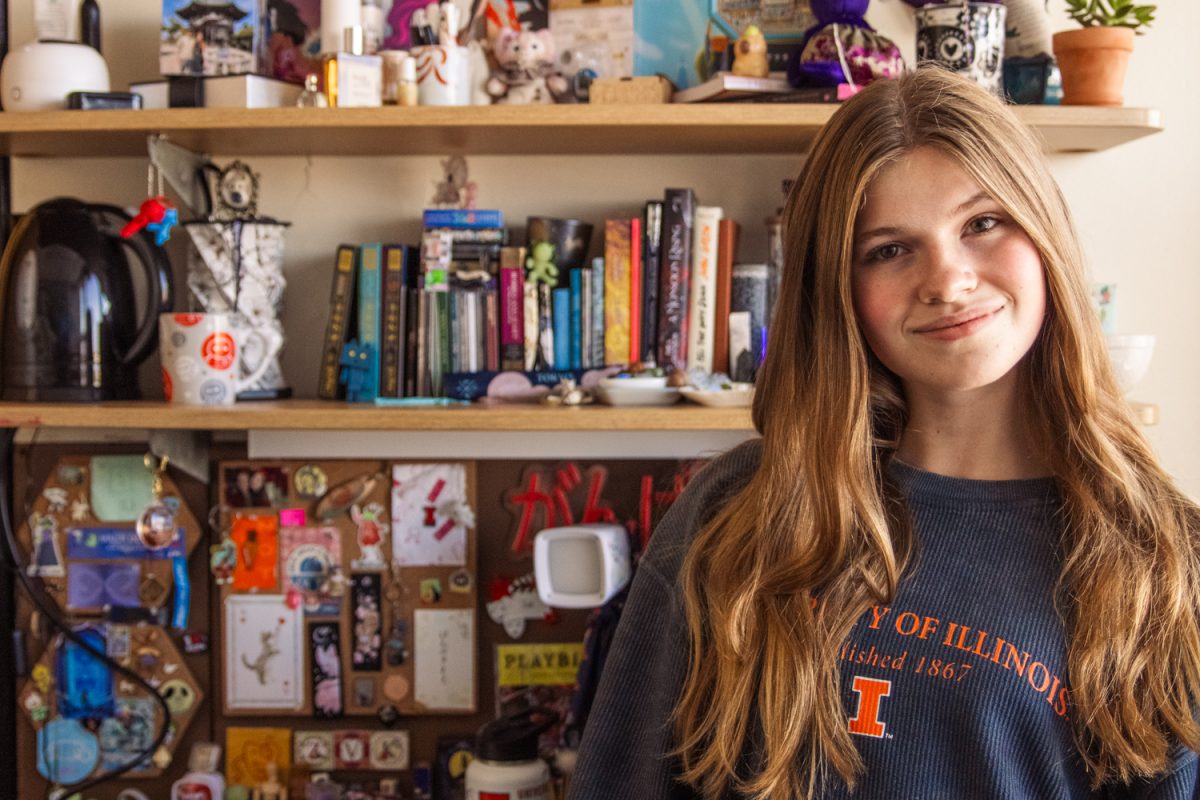 Zoë Van Krey, a sophomore in FAA, poses in front of her desk, which is covered in items she has collected over the years, on Sept. 17. 