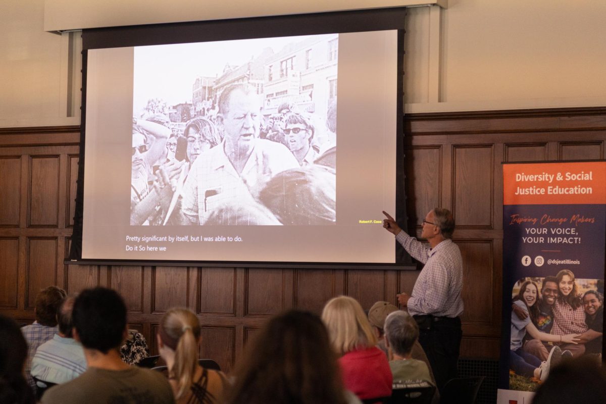 University alum Robert Case presents pictures showing protests against the expansion of the Vietnam War on campus in 1970. He presented his images as part of a presentation for the University YMCA’s Friday Forum and Conversation Café on Friday afternoon.