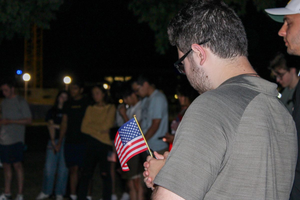 Attendees listen to speakers at the vigil honoring conservative activist Charlie Kirk at South Quad on Sept. 11. Kirk was shot and killed at a campus debate for his tour in Utah on Sept. 10. 
