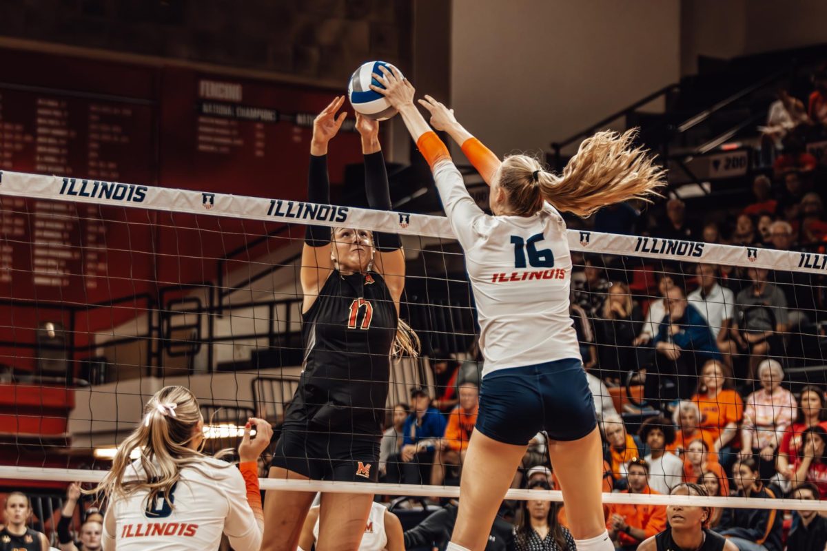 Freshman middle blocker Ashlyn Philpot rises to block Maryland’s attack during an intense first set on Oct. 20, 2024.