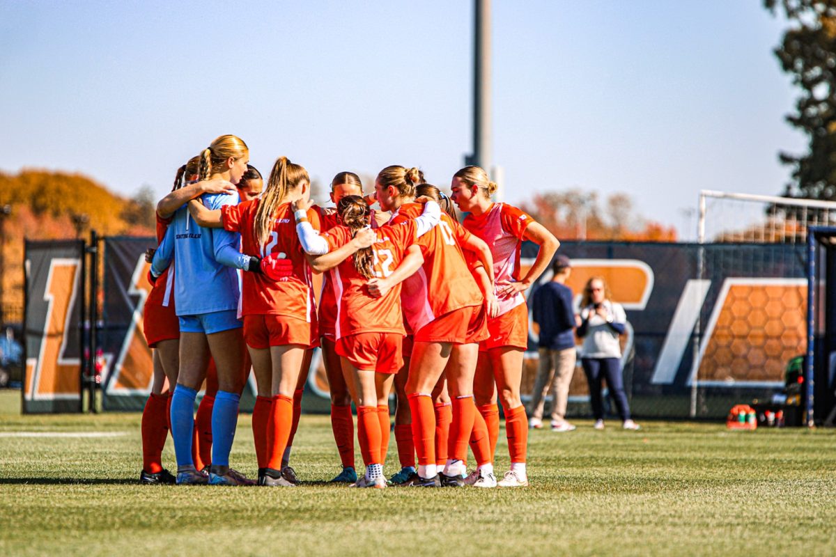 Illinois huddles ahead of its match against Northwestern on Oct. 27, 2024.