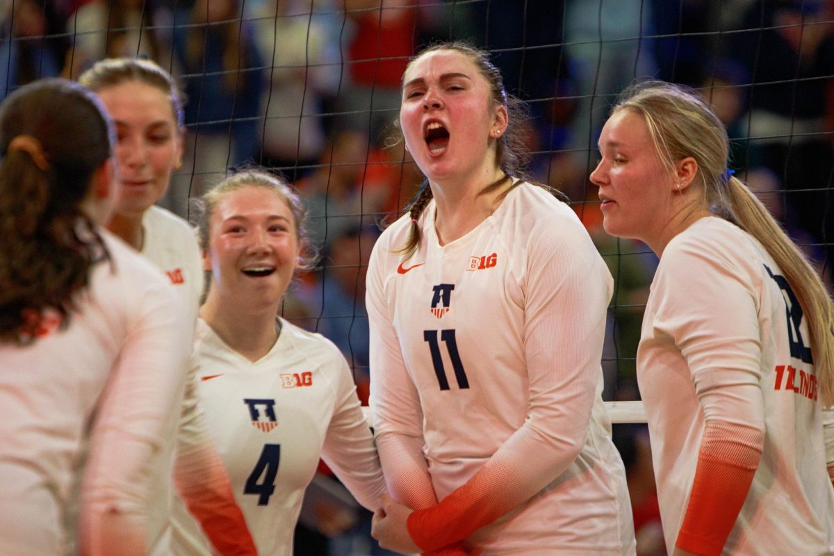 Senior middle blocker Cari Bohm fired up during huddle as Illinois takes on Ohio State on Nov. 9, 2024. 