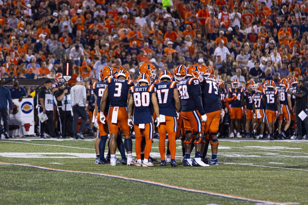 The Illinois offensive unit in huddle during the game against Western Michigan on Sept. 13. 