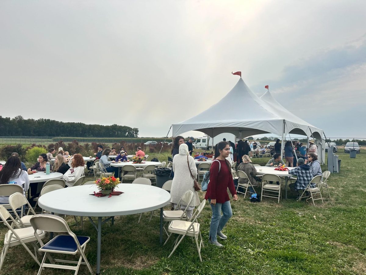 Students and community members attending the Sustainable Student Farm open house on Friday in Urbana. The SSF grows produce to supply University dining halls and sell goods on the Main Quad.