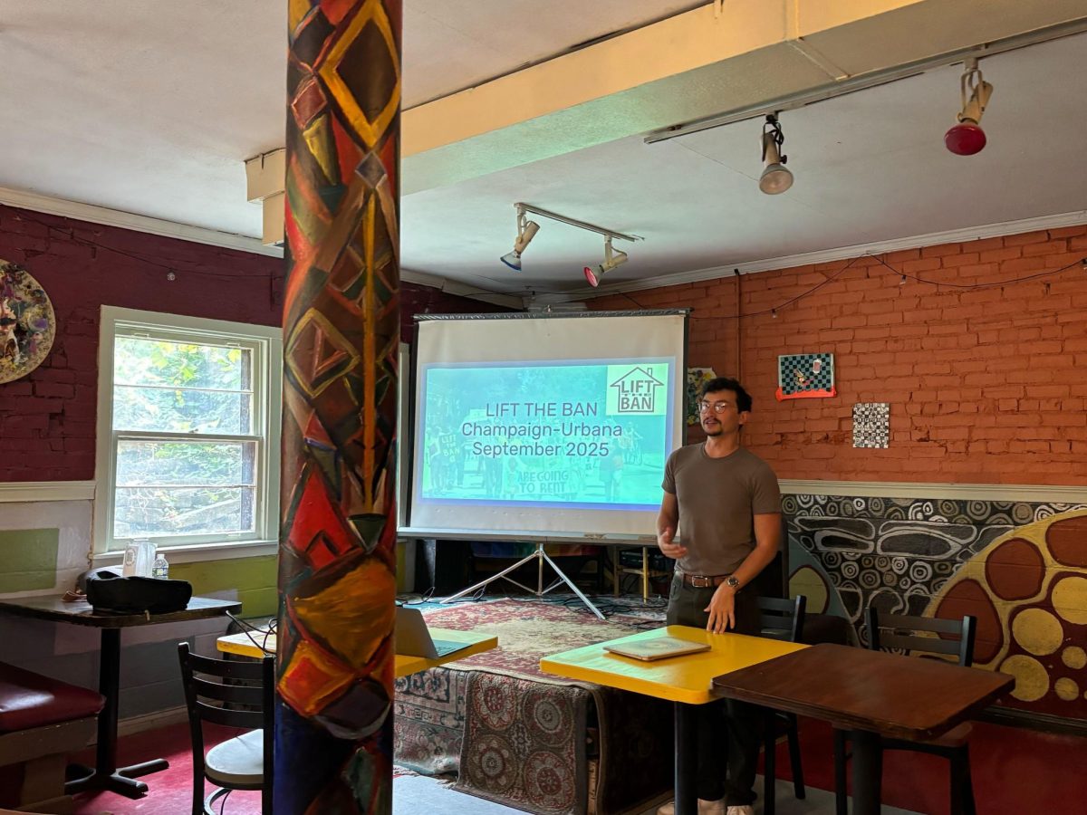 Diego Morales, campaign coordinator for Lift the Ban Coalition, advocates for an end to the ban on rent control in Illinois on Saturday at the Channing Murray Foundation in Urbana. 