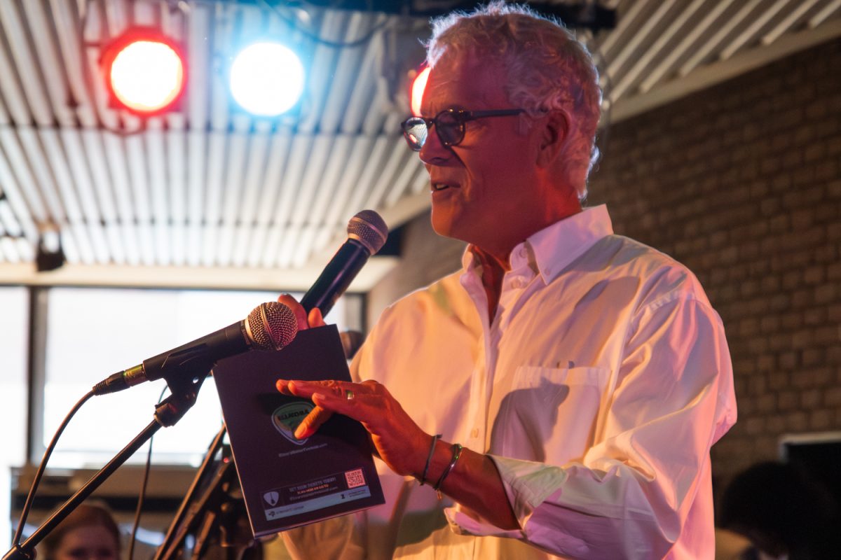 Mike Ross, director of the Krannert Center for Performing Arts, welcomes patrons to the ELLNORA guitar festival, which kicked off Krannert's 2025-2026 season on Thursday.