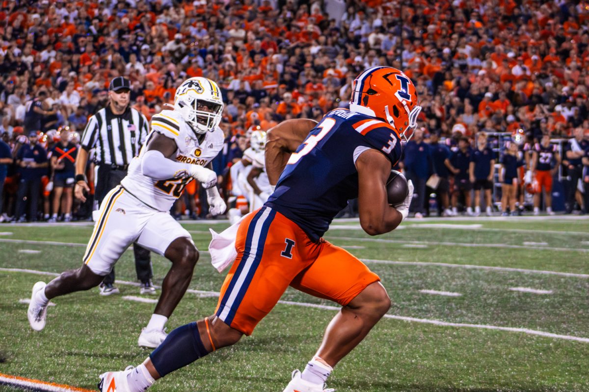 Junior running back Kaden Feagin runs the ball past a Western Michigan defender on Sept. 13.