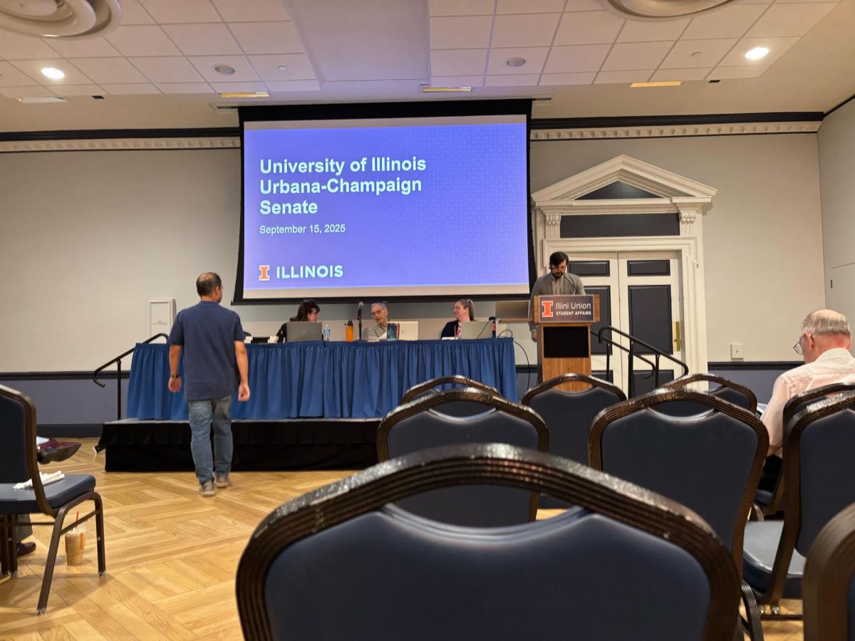 University senators sit at a table before their monthly senate meeting at the Illini Union on Sept. 15. The University Senate voted against the proposal for establishing an ad hoc committee for honorary degree awards.