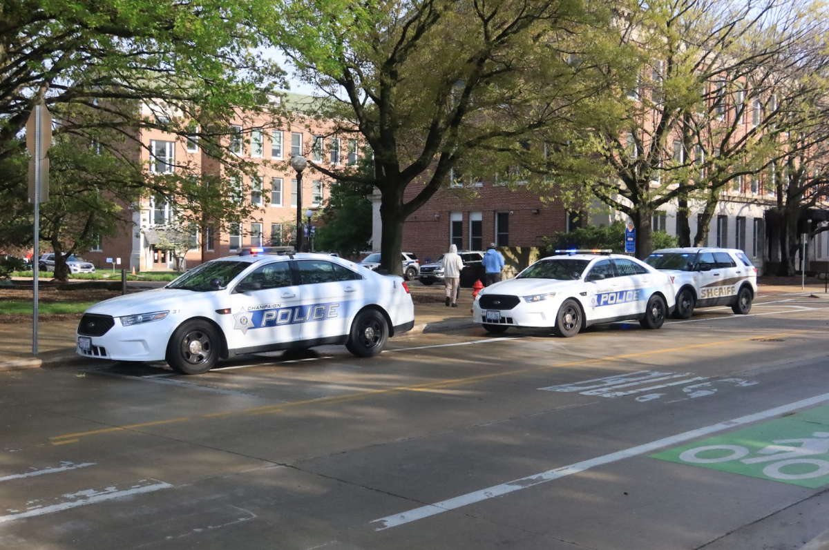 Champaign Police vehicles stand parked on Wright Street in April 2024. The department just concluded a traffic safety campaign leading up to Labor Day weekend. 