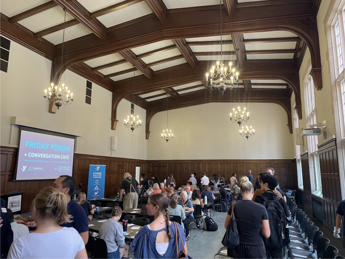 Attendees gather in the University YMCA for a Friday Forum and Conversation Café discussing immigration concerns on Friday afternoon. Representatives from the New American Welcome Center discussed resources, education and legal processes for immigrants. 