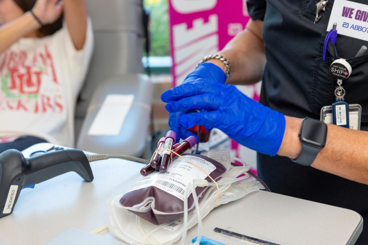 A volunteer collects blood samples at a blood drive. On Sept. 13-19, the University will face off against Indiana University in a weekly challenge as part of Abbott and the Big Ten Conference’s “We Give Blood” contest. 
