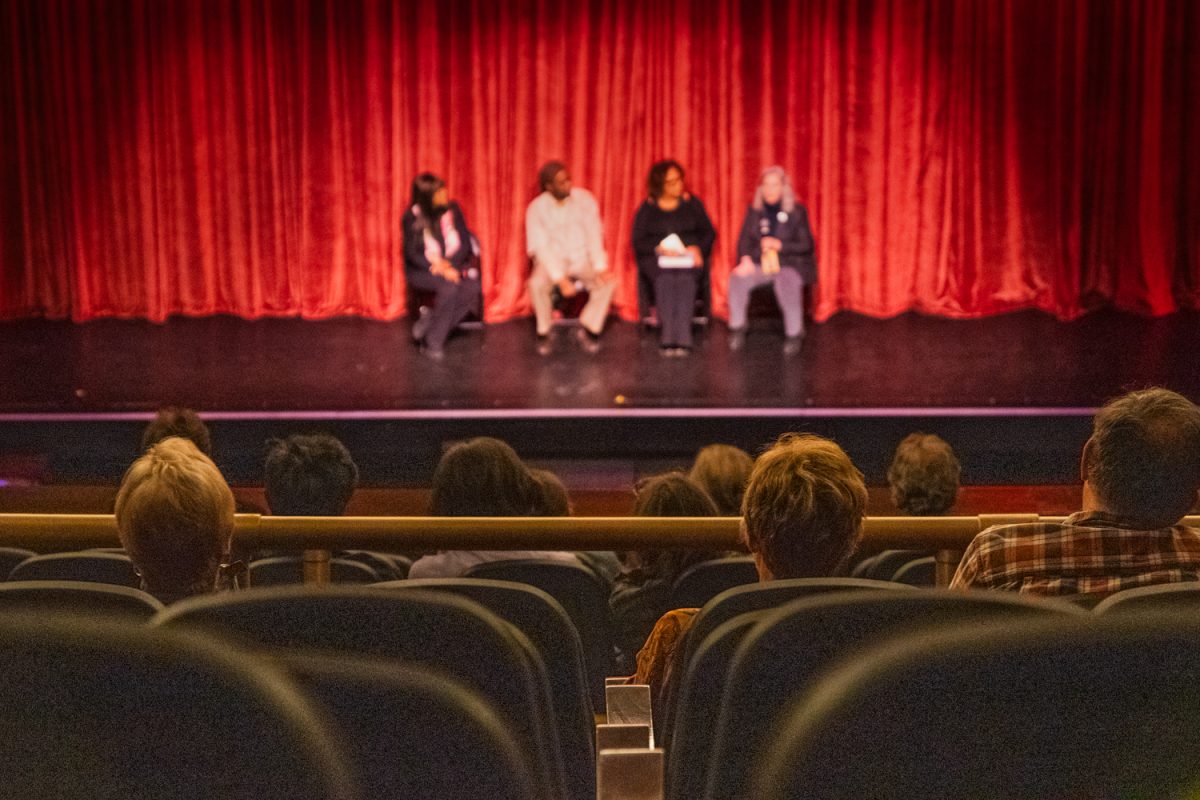 Audience members listen to a panel during Ebertfest at the Virginia Theater in Champaign on April 26.