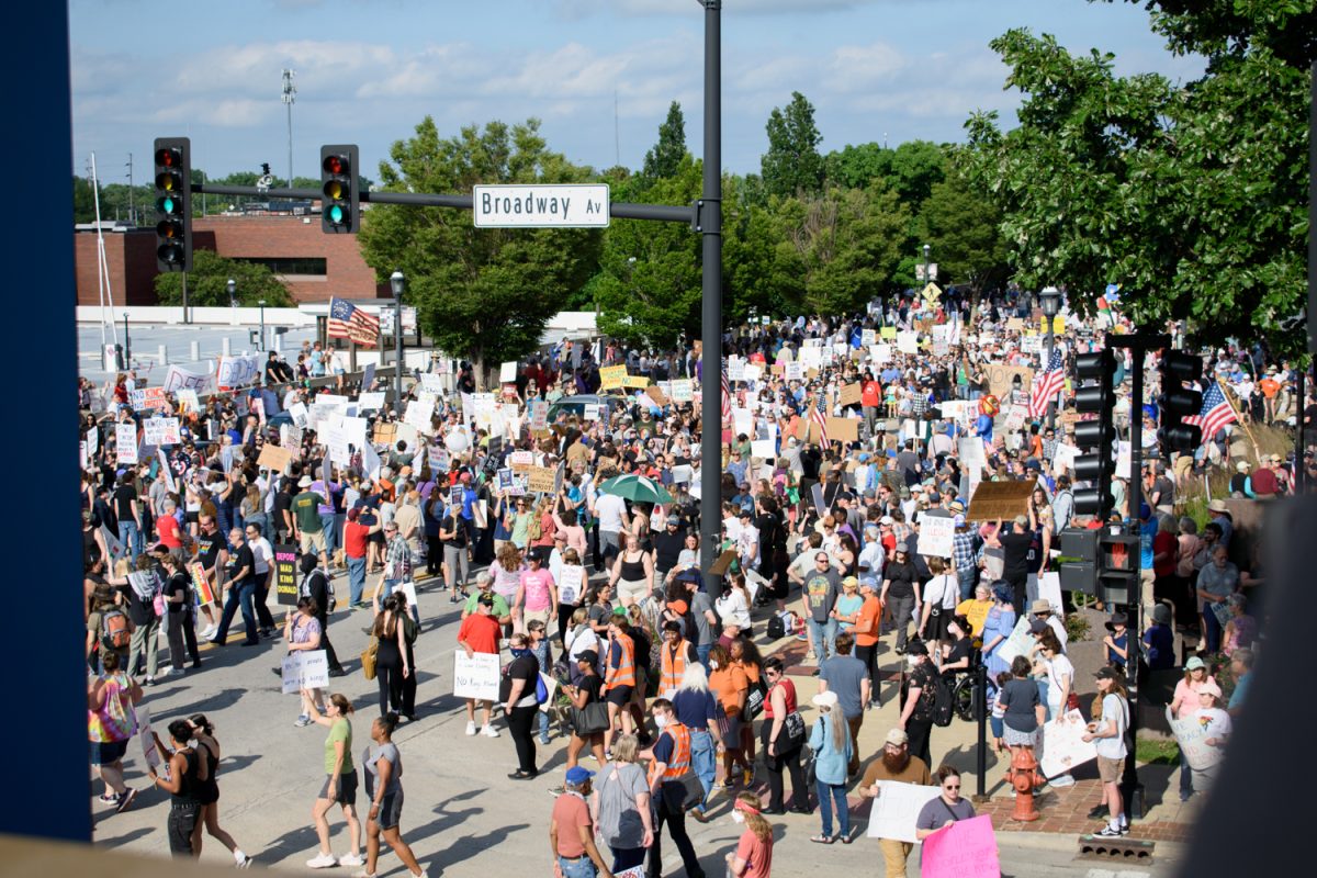 Protesters fill the intersection of Main Street and Broadway Avenue in Urbana at the No Kings Day protest on June 14. Protesters will hold another No Kings rally in Urbana on Saturday.