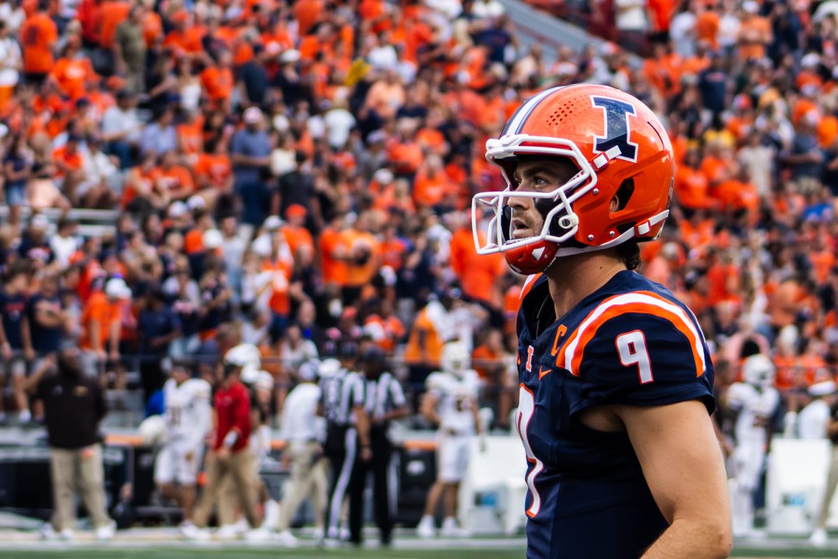 Senior quarterback Luke Altmyer warms up before the Illinois vs. Western Michigan on Sept. 13.