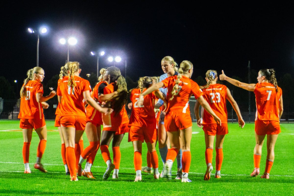 The Illini celebrate after senior forward Lia Howard gives them a 2-1 lead against the Penn State Nittany Lions on Sept. 26.