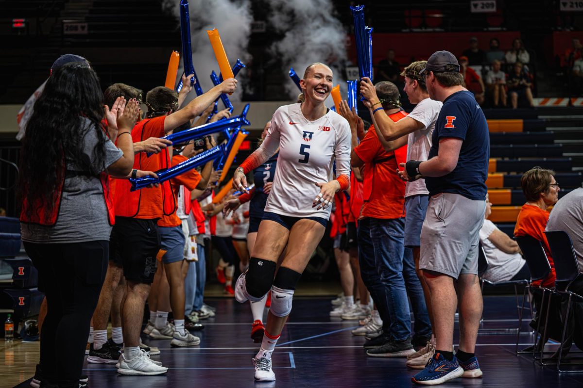 Outside hitter Taylor de Boer runs out on the court before the Illini’s game against the Oregon Ducks on Sept. 26. 
