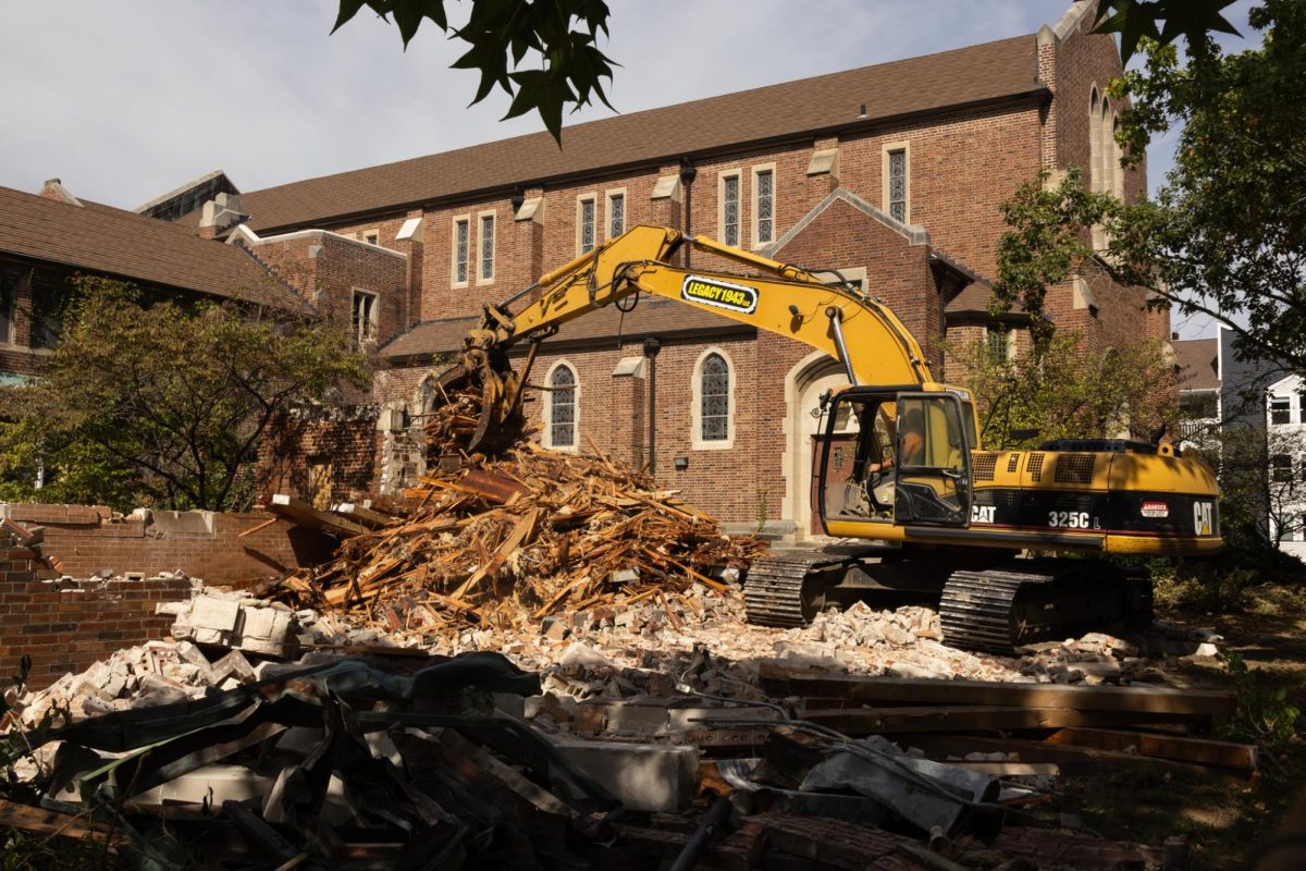 Demolition work continues around the former Uniplace Christian Church in Champaign on Oct. 1. The church and connected apartment building were built in 1934, and the complex was sold over the summer to be redeveloped as apartments.