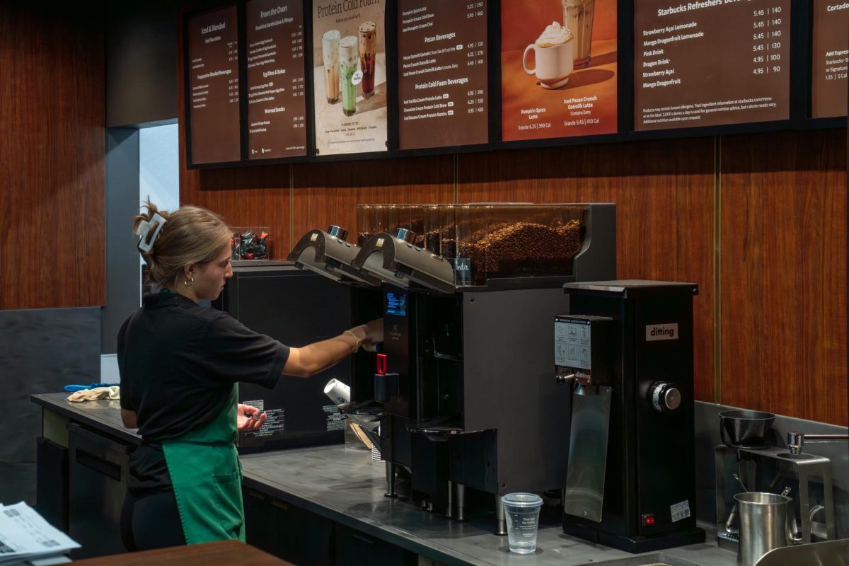 A barista working at the renovated Starbucks in the Illini Union on Oct. 1.