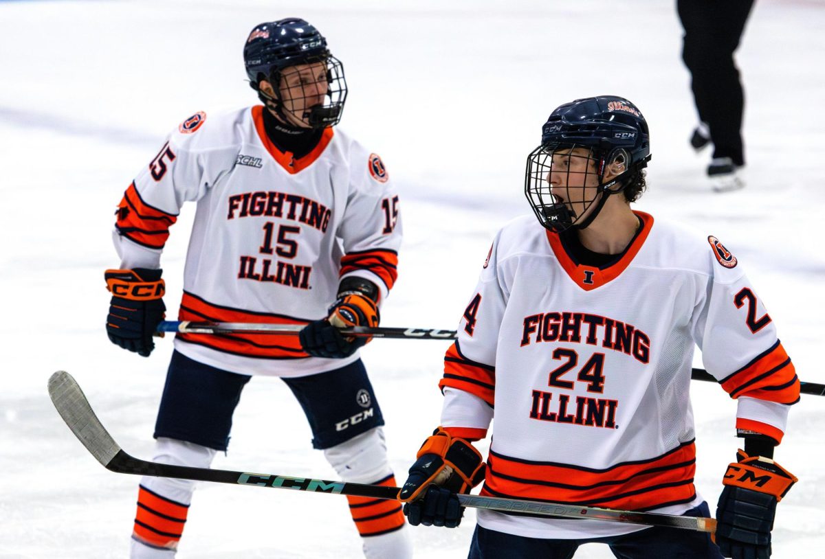 Hockey brothers duo senior forward Gregory Etingen and junior forward David Etingen skate over to the face-off in the first quarter of a match on Oct. 3. Illinois lost to Roosevelt University at the Illinois Ice Arena in three quarters with overtime. 