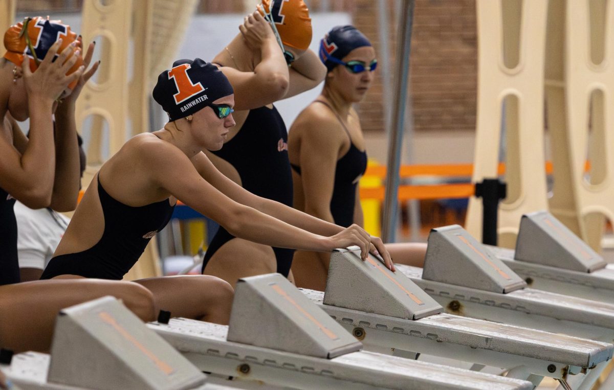 Several Illini, including sophomore Kennedy Rainwater, prepare for competition during the Orange vs. Blue meet on Oct. 4. 