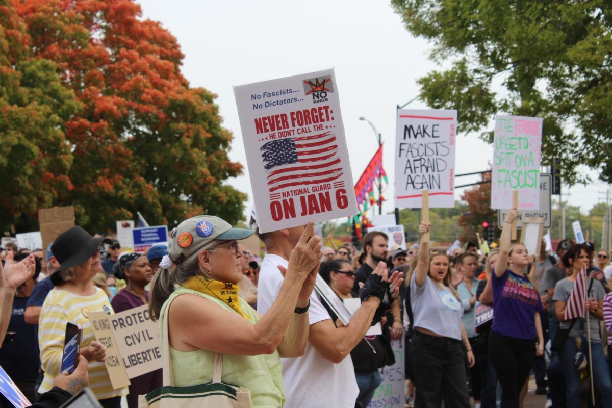 Protestor hold signs while at the No Kings protest held outside of the Champaign County Courthouse on Saturday. This was one of many No Kings events held across the country protesting the Trump administration.