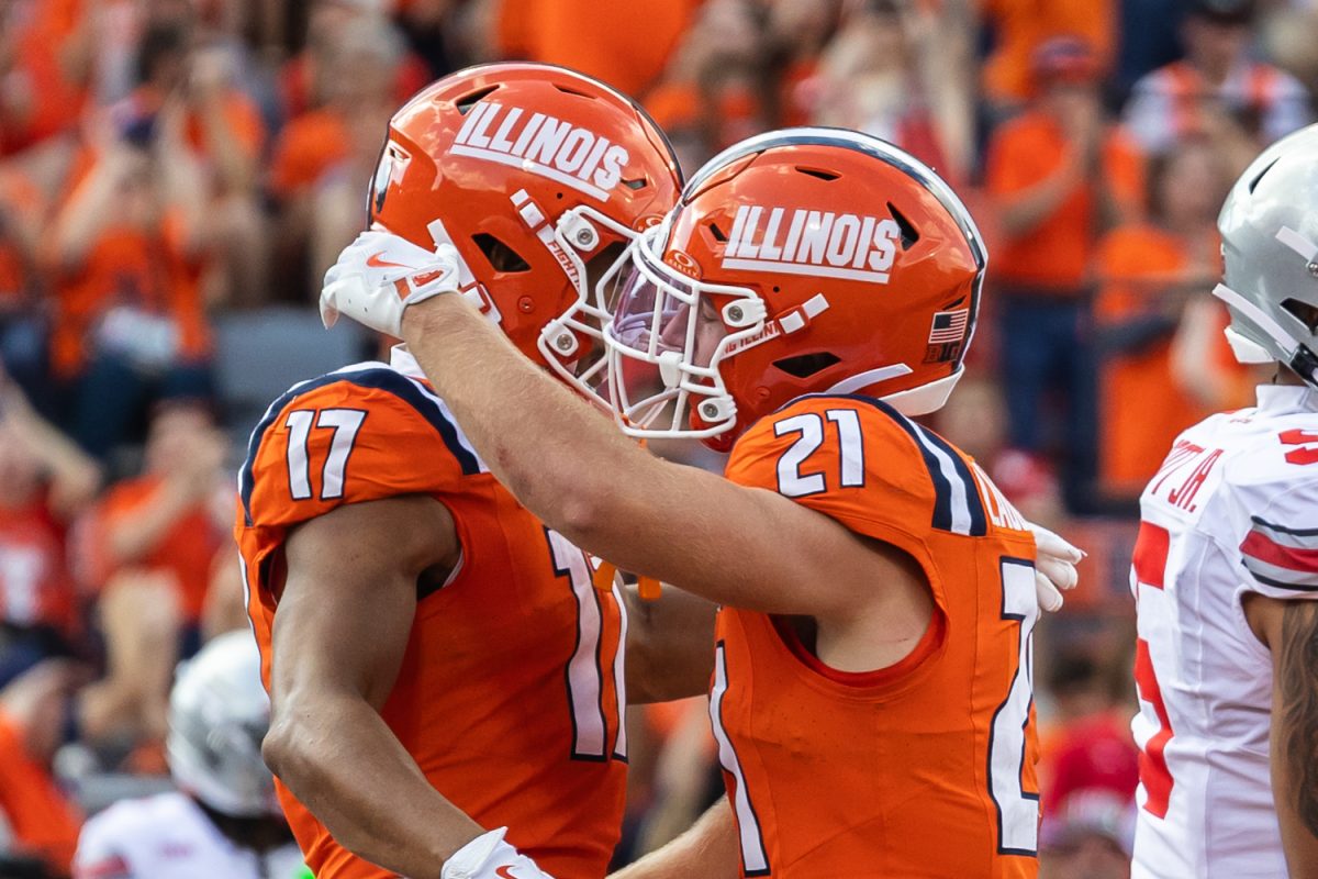 Junior running back Aidan Laughery embraces sophomore wide receiver Collin Dixon after his fourth quarter touchdown at the game versus No. 1 Ohio State University on Oct. 11. Laughery and Dixon scored the only two Illinois touchdowns of the game.