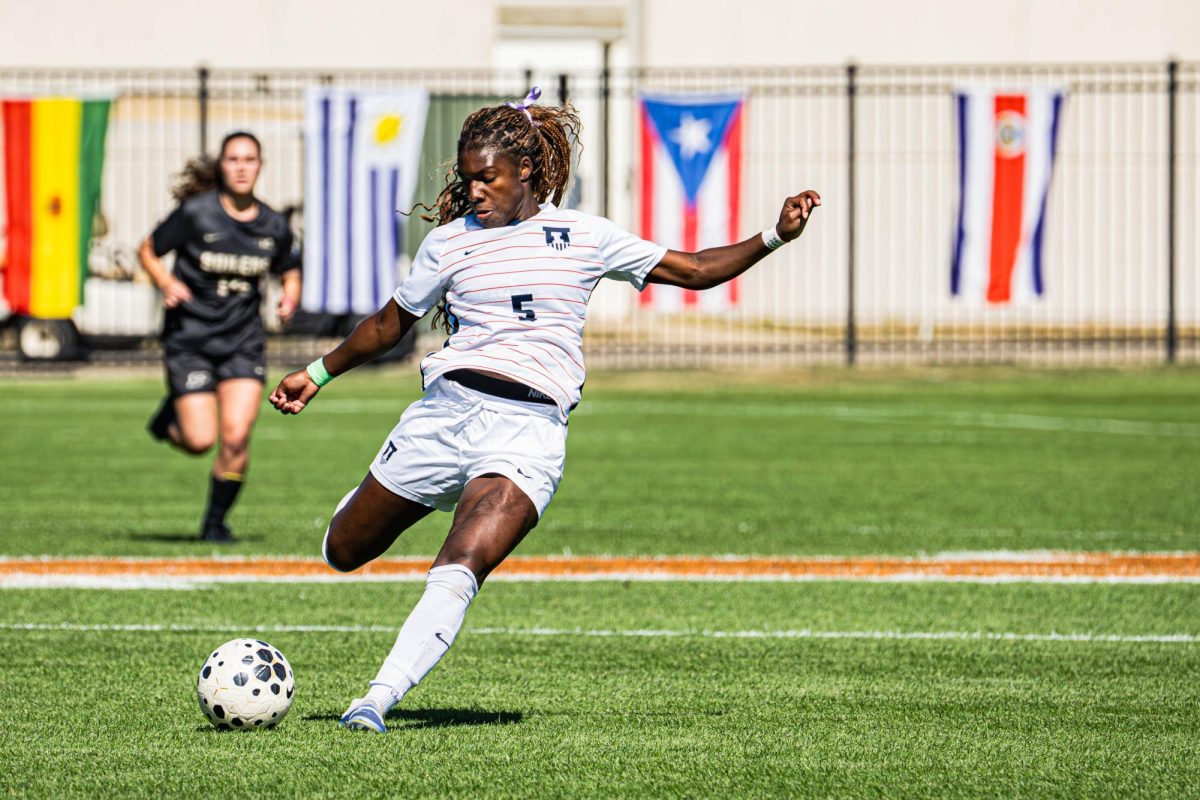 Sophomore Cayla Jackson aims for a kick during Illinois’ match against Purdue on Oct. 12.