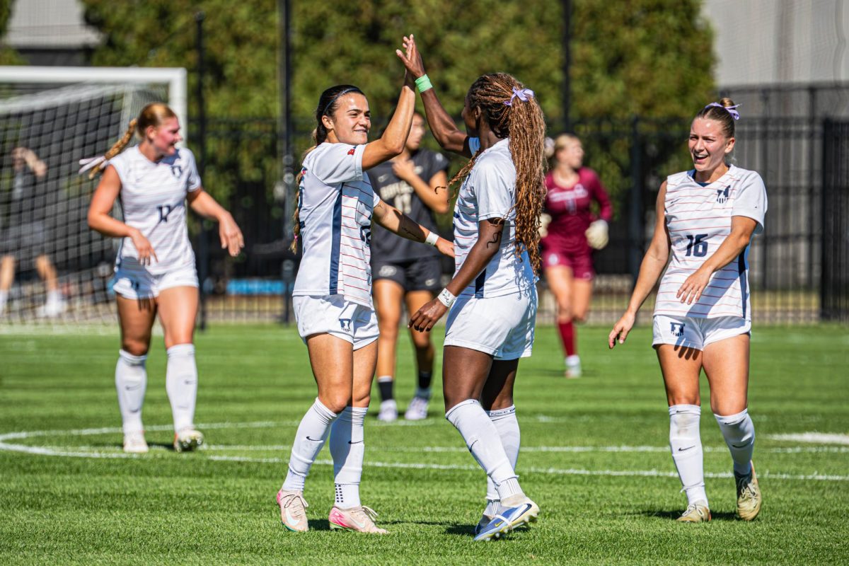 Sophomore forward Cayla Jackson (right) and senior forward Lia Howard (left) celebrate together following a Jackson goal during their match against Purdue on Oct. 12. Illinois would go on to win the match 1-0.