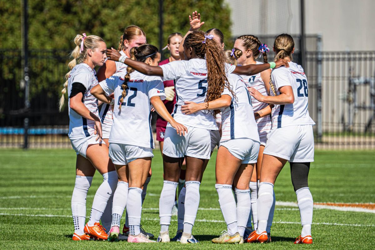 The Illini huddle during the team’s match against the Purdue Boilermakers on Oct. 12.