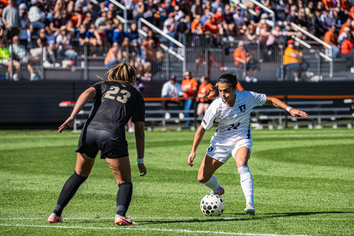 Senior forward Lia Howard dribbles the ball against Purdue on Oct. 12. 