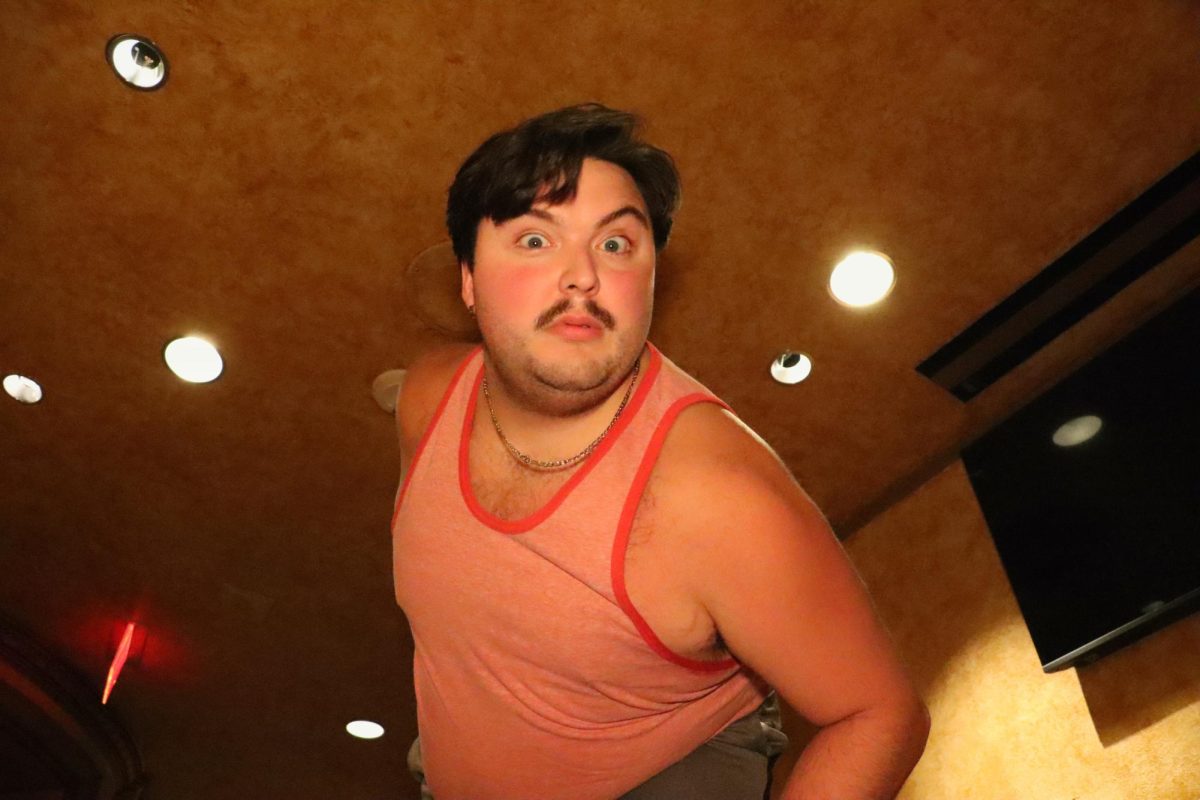 Dylan Holt strikes a dramatic pose as the iconic Dr. Frank N Furter during an interview with the Daily Illini on Oct. 17. This Rocky Horror shadow cast production opens at the Virginia Theatre on Oct. 25.