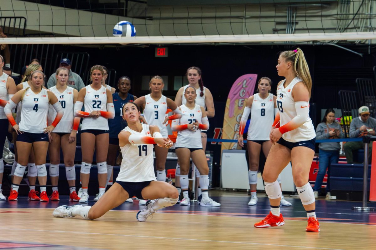 Freshman outside hitter Alyssa Aguayo receives a serve from Michigan at Huff Hall Saturday night. Illinois lost this game and would lose again to Minnesota on Wednesday.