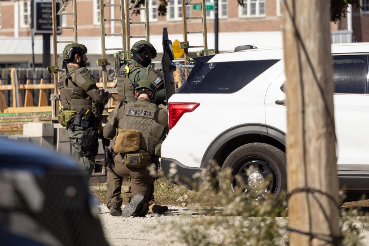 UIPD and Champaign Police Department SWAT officers carry out a search warrant at 57 E. Springfield Ave. after obtaining a warrant for a criminal investigation.