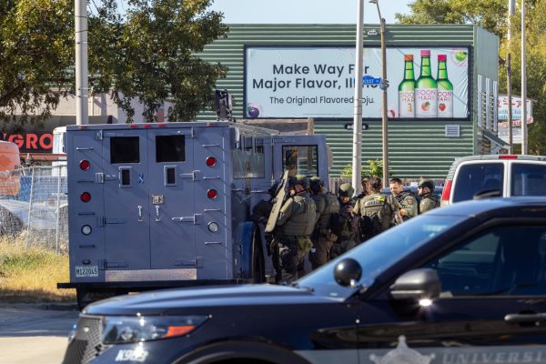 UIPD and Champaign Police Department SWAT officers execute a search warrant at 57 E. Springfield Ave. in relation to an ongoing criminal investigation.