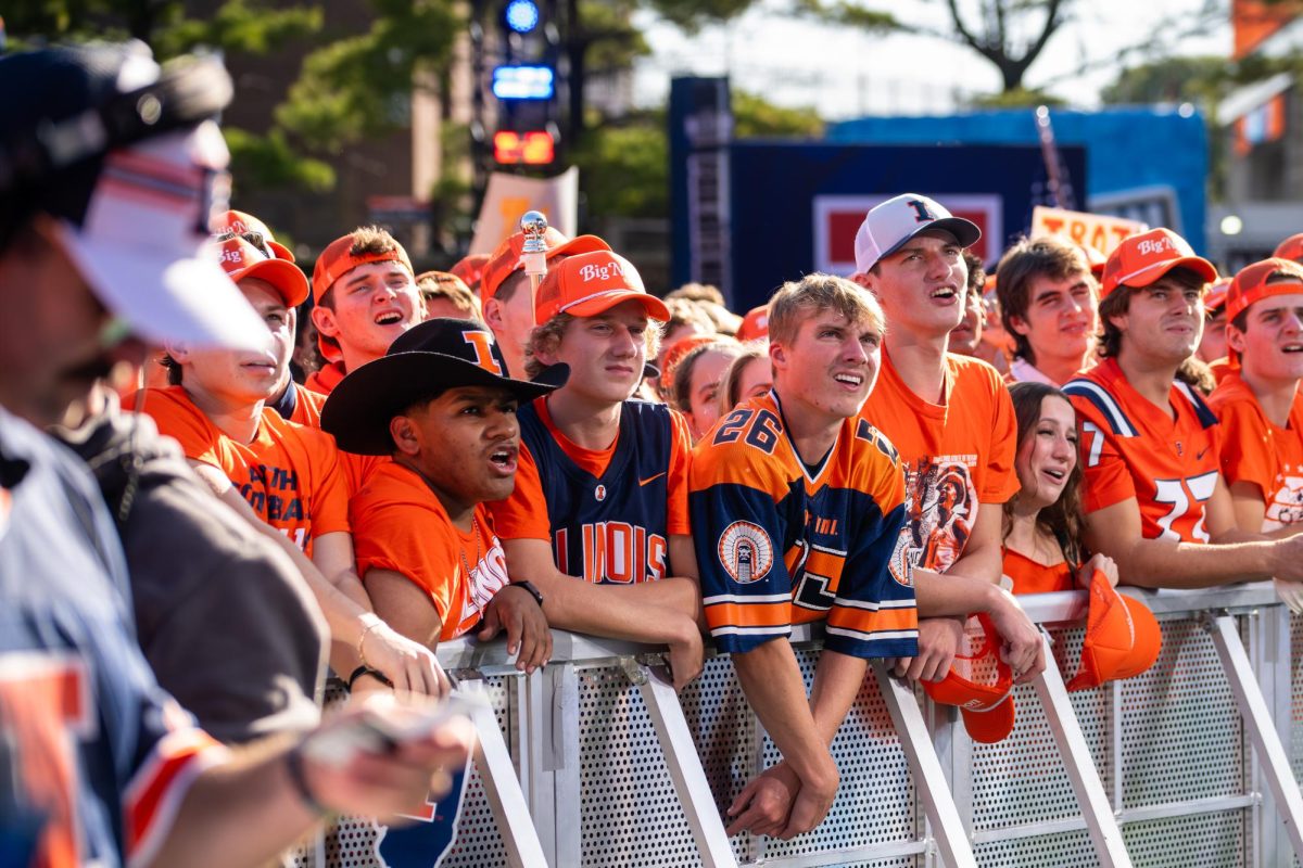 Illini fans watch Big Noon Kickoff at Grange Grove ahead the game against USC on Sept. 27.