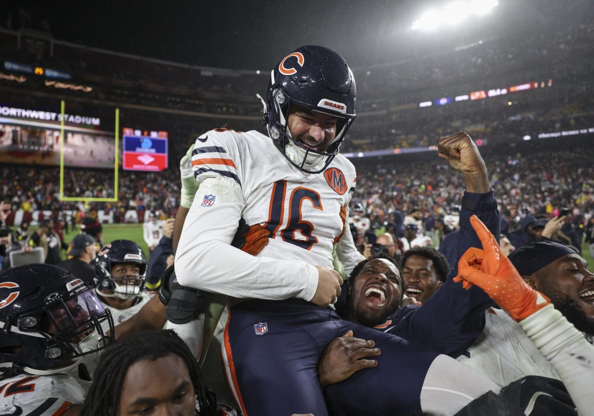 Bears kicker Jake Moody is lifted by his teammates as he celebrates his game-winning field goal to defeat the Commanders on Oct. 13 at Northwest Stadium in Landover, Maryland.