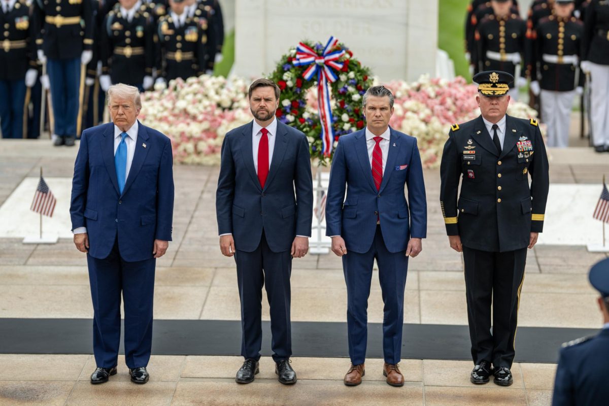 President Donald Trump, Vice President JD Vance and Secretary of War Pete Hegseth participate in a wreath-laying ceremony at the Tomb of the Unknown Soldier on May 26 at Arlington National Cemetery. Trump and Hegseth ordered National Guard deployments in Chicago, now challenged in a lawsuit by Illinois.