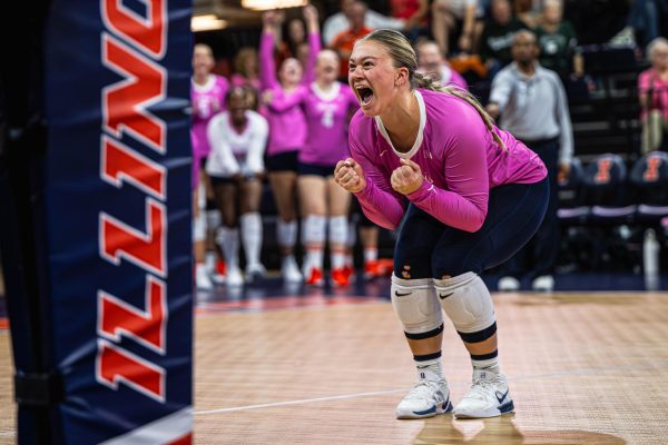 Sophomore Defensive Specialist/Libero Kenzie Cogan celebrates after Illinois scores a point during their match against Michigan State on Oct. 5. Illinois would go on to win the match 3-2.