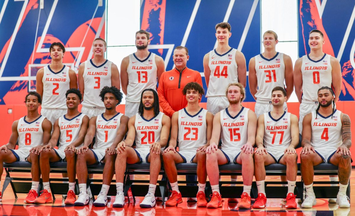 The Illinois men's basketball team and head coach Brad Underwood pose together for a team photo on media day, Oct. 2. The 2025-2026 team features seven new players, accounting for half the team.