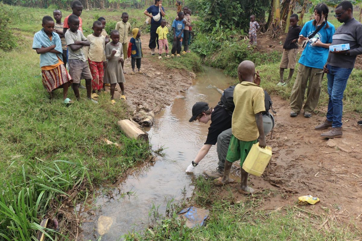 Members of the Illinois Engineering Without Borders chapter conduct water quality tests on a community's water supply on Aug. 16.