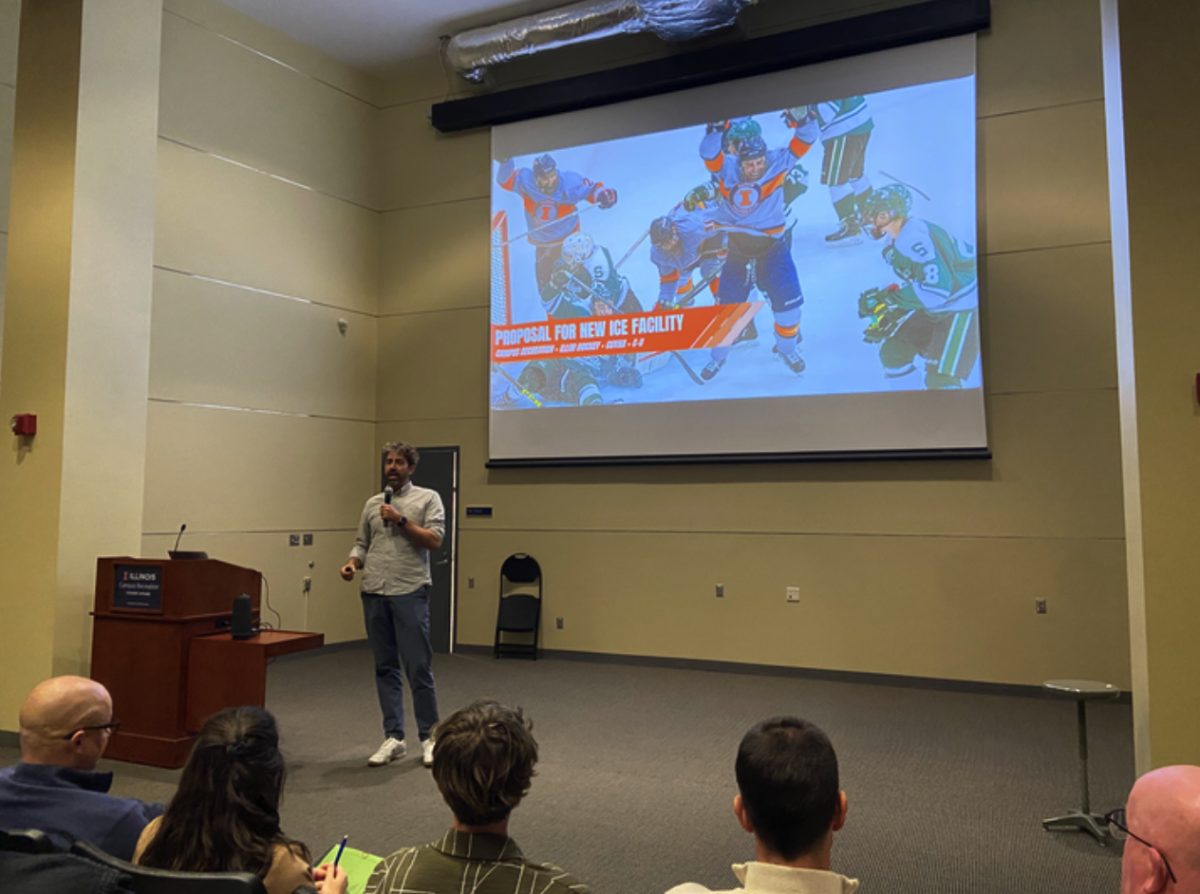 Collin Carlier, CEO of Royse and Brinkmeyer Apartments presents a proposal for a new ice arena at a town hall meeting at the ARC auditorium on Wednesday.