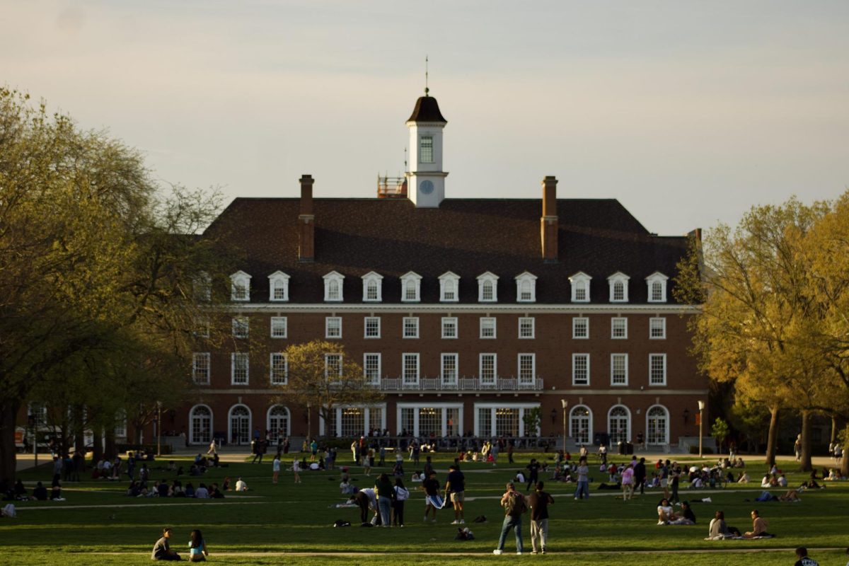Students gather on the Main Quad on April 22. The UI System and the University adopted a new financial aid policy, removing race, color, national origin and sex from consideration for need and merit-based aid.