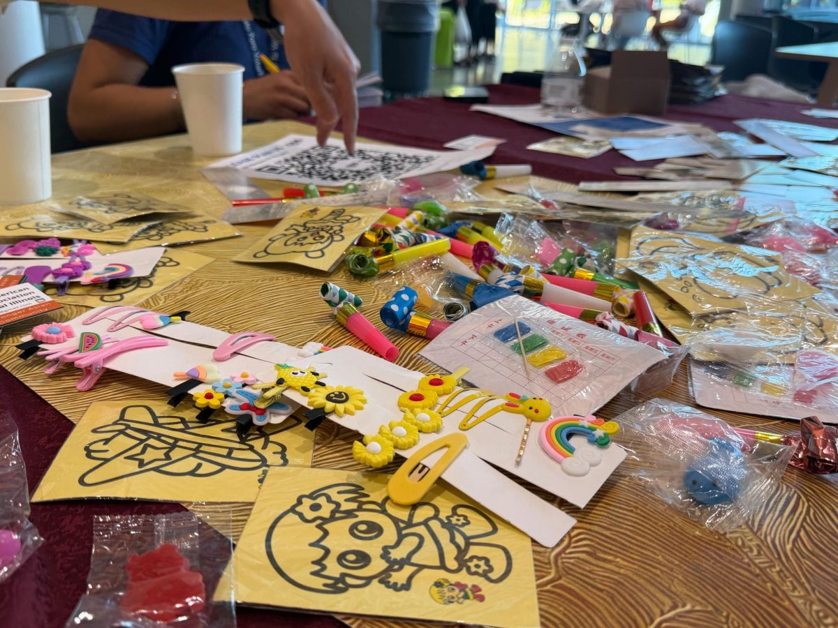 Freebies, including sand art, barrettes and noisemakers, were offered to attendees at the Mid-Autumn Festival at the Siebel Center for Design Sunday. The Chinese American Association of Central Illinois presented the festival, celebrating Chinese culture and tradition at the University. 